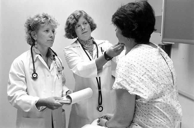 Doctors with patient. Image: Seattle Municipal Archives via Wikimedia Commons 