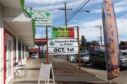 A medical marijuana dispensary displays a sign Monday, Sept. 28, 2015, in Portland, Ore. Oregon's medical marijuana dispensaries are getting ready for a watershed moment this week: when recreational pot users will also be able to buy weed at their pot shops. (AP Photo/Gosia Wozniacka)