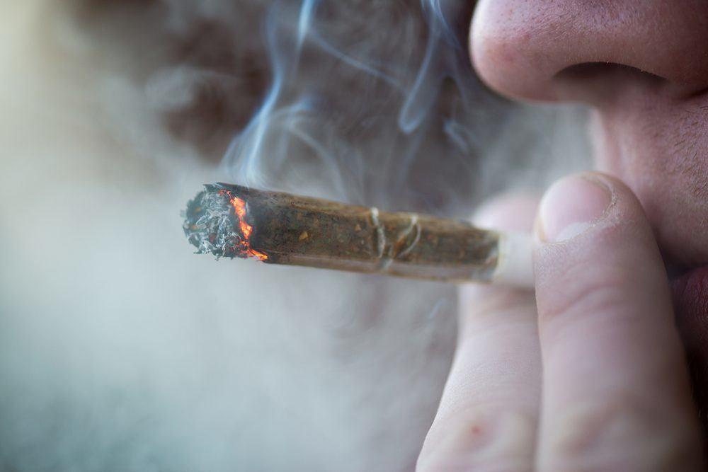 Image of someone smoking a marijuana spliff
