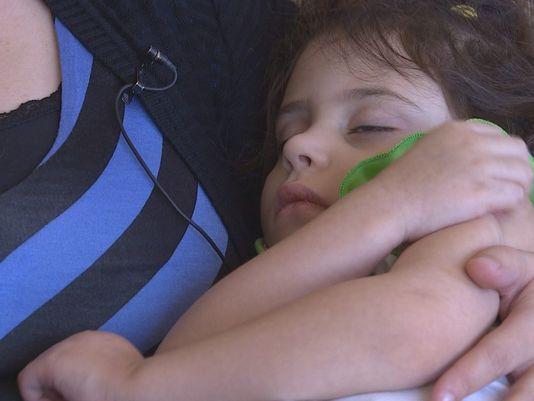 Hannah Loew, a child who suffers from a severe form of epilepsy called Dravet Syndrome, is among dozens who have moved to Colorado to receive higher concentrated doses of marijuana. Photo: KHOU