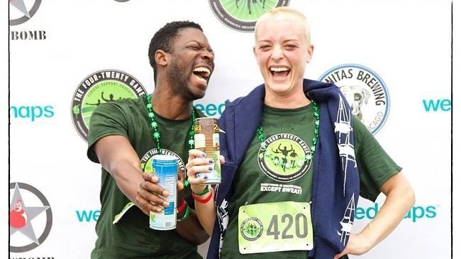 Two race participants celebrate their finish at the Saturday 4.2-mile race. Image: 420 Games via MarketWatch
