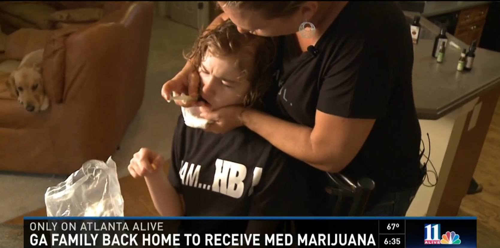 Image of Corey Lowe giving her daughter CBD Oil for her seizures