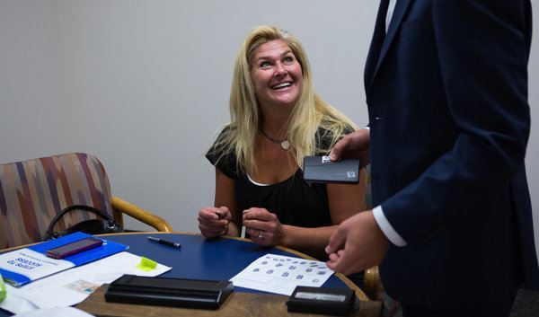 Erika Walton, 43, fills out paperwork to have a marijuana violation expunged from her record. Credit Ruth Fremson/The New York Times