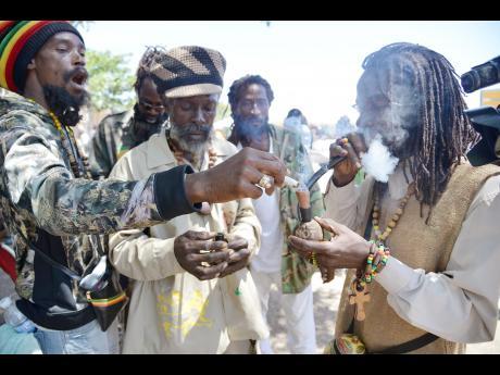 Image of Jamaican Rastafarian smoking the herb Mon 
