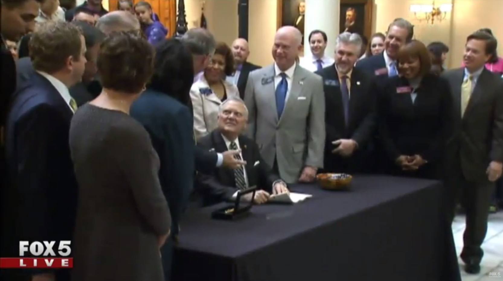 Image of Georgia Governor Nathan Deal signing a bill to leagalize Maedical Marijuana