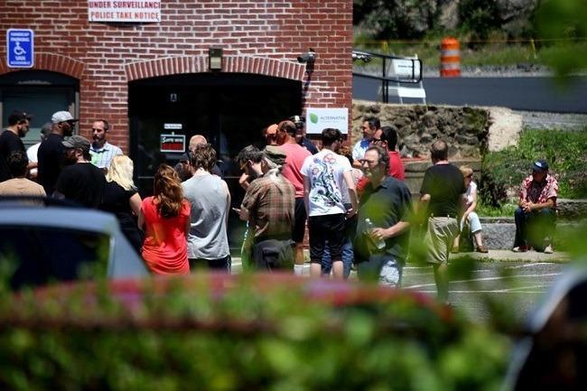 Customers waited for the first medical marijuana dispensary in Massachusetts to open in Salem, on June 24. Image: Jonathan Wiggs/Globe Staff