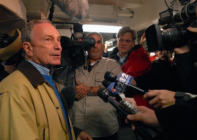 Michael Bloomberg, then Mayor of New York, speaks to the media aboard the amphibious transport dock ship Pre-Commissioning Unit (PCU) New York (LPD 21) in Nov. 2009. Image: U.S. Navy via Wikimedia Commons