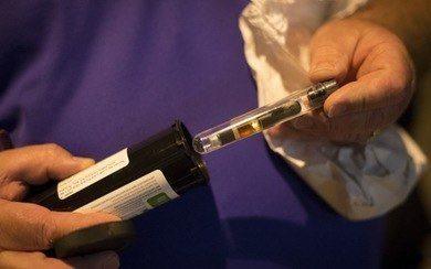 Patrick McClellan held a vaporizer with medical marijuana early Wednesday morning after acquiring a prescription at MinnMed.  Aaron Lavinsky, Star Tribune