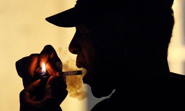 2011 file photo of an unidentified man smokes medical marijuana during karaoke night at the Cannabis Cafe, in Portland, Ore. At a July 3 event, Weed the People, people will gather to smoke legally and receive free marijuana from Oregon growers. (AP Photo)