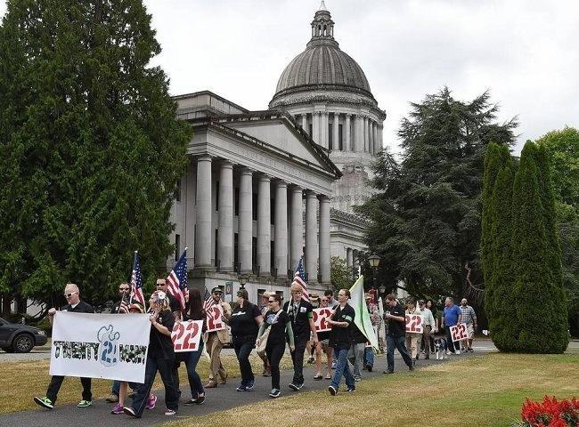  Veterans and their supporters march in Olympia to raise awareness of veterans PTSD and suicide issues. Steve Bloom/Staff Photographer