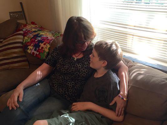 Toni Richard hugs her son Tyler, 14, at home. Tyler has been on medical marijuana for a year. (Photo: Siobhan McAndrew/RGJ)