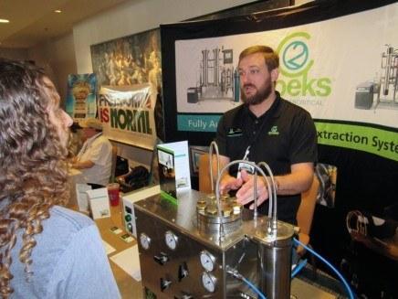 Image of cannabis extractors at a trade show