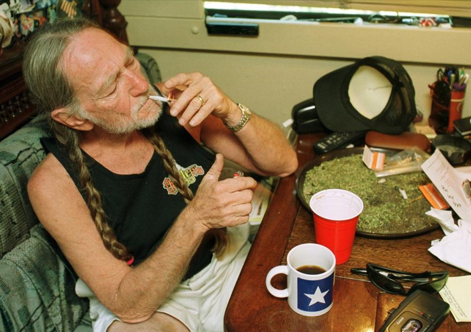 Image of Country Western Music Star Willie Nelson smoking marijuana