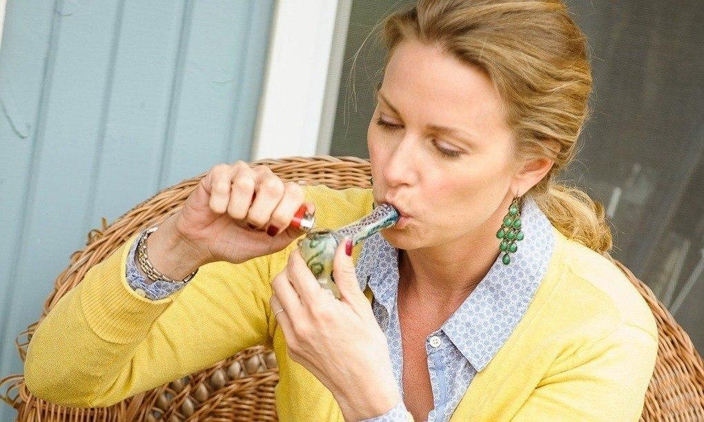 Image of an upper middle class white woman smoking marijuana
