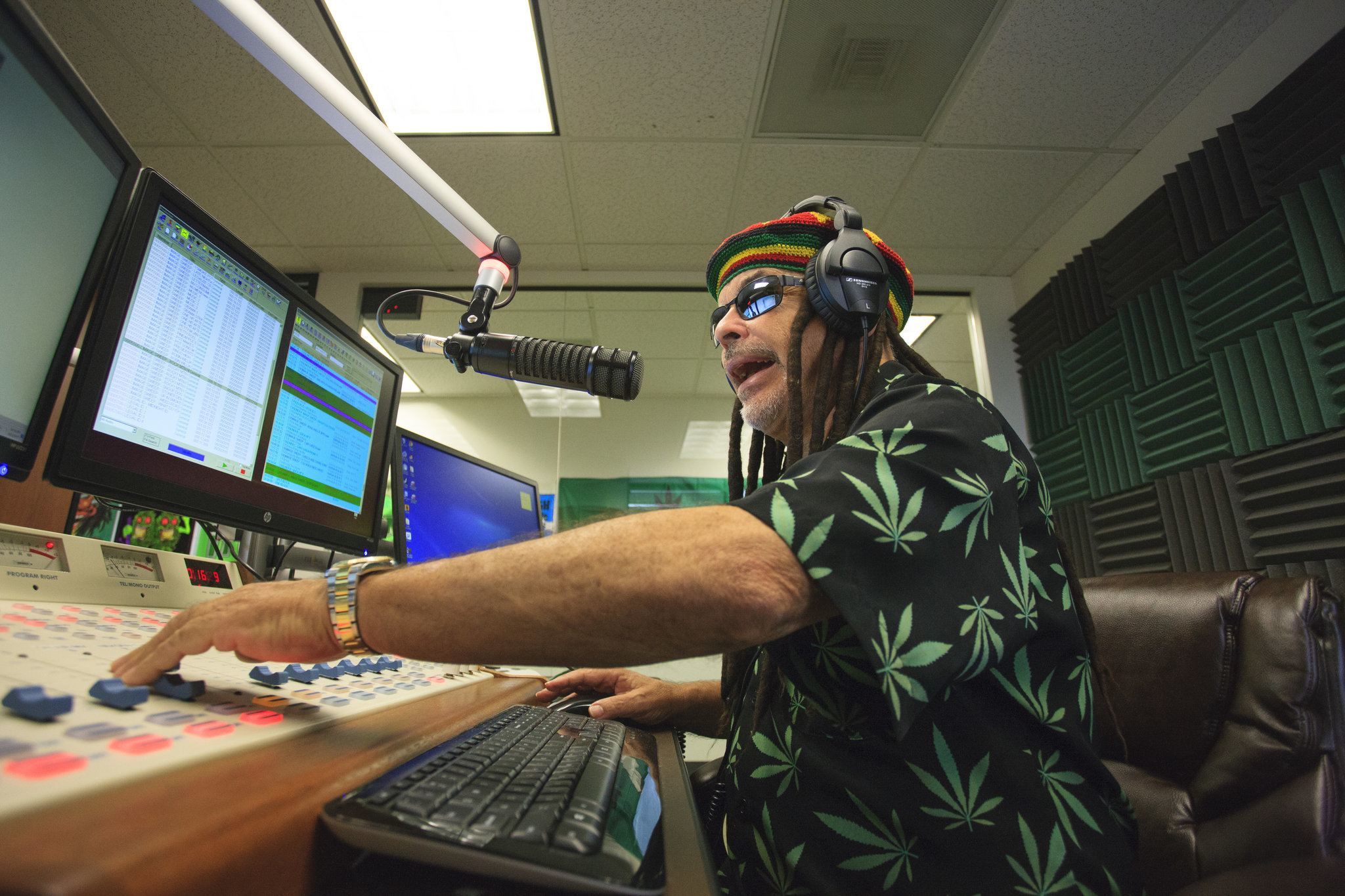 Image of  Marc Paskin, who goes by the name Gary Ganja, on the air in the Smokin 94.1 studio in Denver. Credit Matthew Staver for The New York Times 